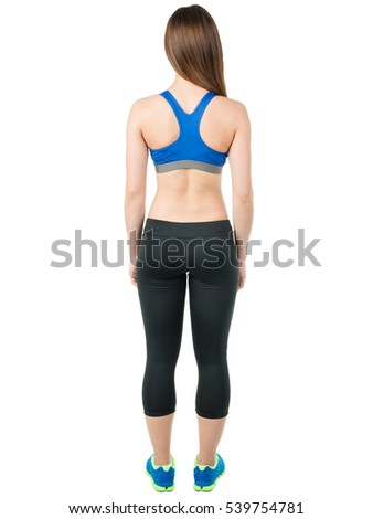 Sports young girl in the form of (a sports bra and shorts) and sneakers is back on a white background. Healthy lifestyle. Mock up. Human
