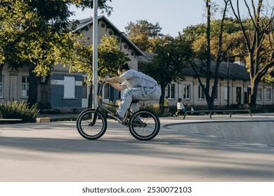 Sportsman cycling in urban area for freestyle exercising with transport - Powered by Shutterstock