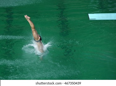 Sportsman Diving In Olympic Swimming Pool From A High-board
