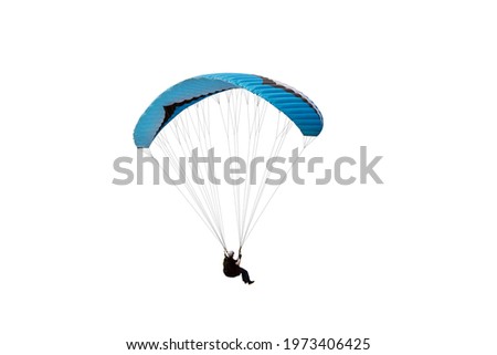 The sportsman flying on a paraglider. Beautiful paraglider in flight on isolated white background. 
