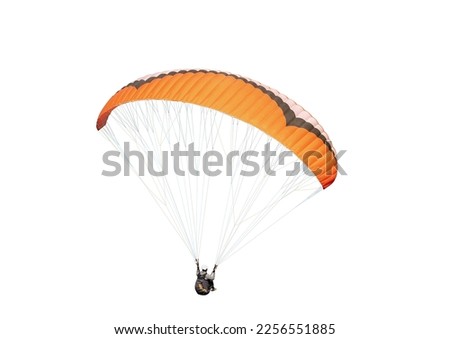 The sportsman flying on a paraglider. Beautiful paraglider in flight on a white background. isolated