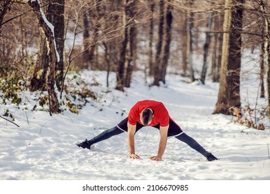 Sportsman In Good Shape Stretching His Legs In Nature At Snowy Winter Day. Healthy Habits, Warmup Exercises, Winter Fitness