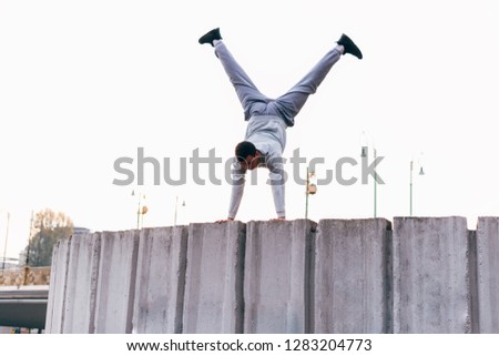 Similar – Image, Stock Photo streetyoga Gymnastics Yoga