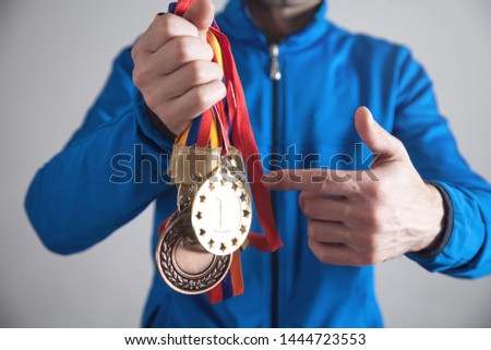 Sportsman with medals. Sport, Winner, Success