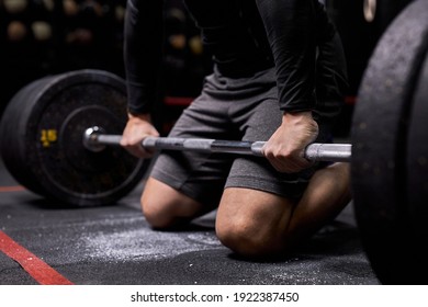 sportsman preparing to lift barbell weight in fitness gym. copy space area for advertise slogan or text message. functional training and cross fit concept. - Powered by Shutterstock