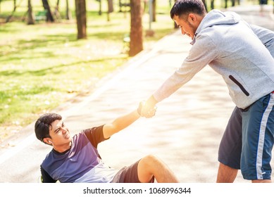 Sportsman Pulls A Friend Down To Get Up