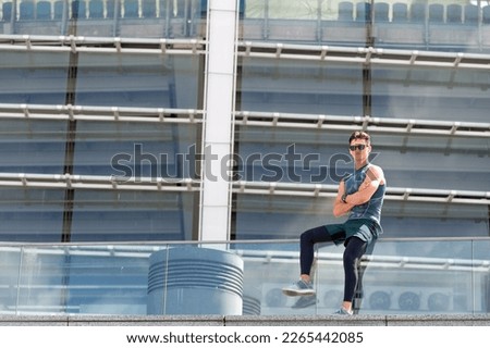 Similar – Athlete at the city park warming and stretching