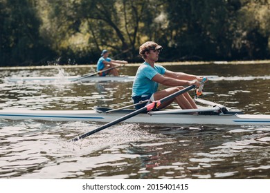 Sportsman Single Scull Man Rower Rowing On Boat. Side View