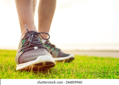 Sportsman's Legs In Running Shoes Close Up