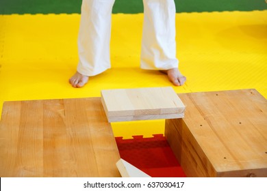 Sportsmen preparing for the competition by breaking wooden boards with his hands in the championship among juniors of the Grodno region Kyokushin karate - Powered by Shutterstock