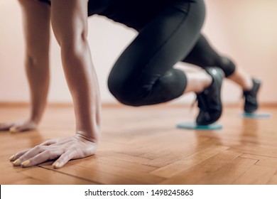 Sportswoman Exercising, Using Gliding Discs.