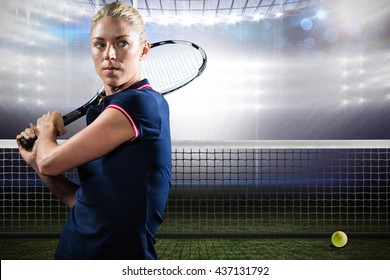 Sportswoman playing tennis in a tennis court - Powered by Shutterstock