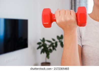 Sportswoman Practicing Aerobic With Dumbbells. Woman Lifting Weights And Working Out At Home. Healthy Lifestyle. Stay At Home Activities.