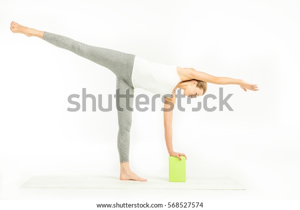 Sportswoman Standing On Yoga Mat Doing Stock Photo Edit Now