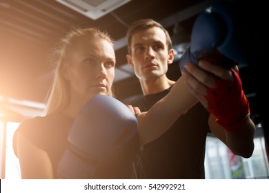 Sportswoman Trains Boxing With Coach