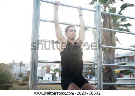 Similar – Strong Man Stretching Calf and Leaning on Wall