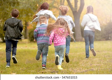 Sporty Children Running In The Park