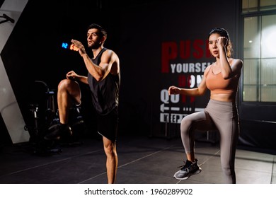 Sporty Couple Cardio Exercise Burning Calorie HIIT And Squat In Fitness Gym Fit Body Healthy Lifestyle Athlete Muscle Building Strong Concept.