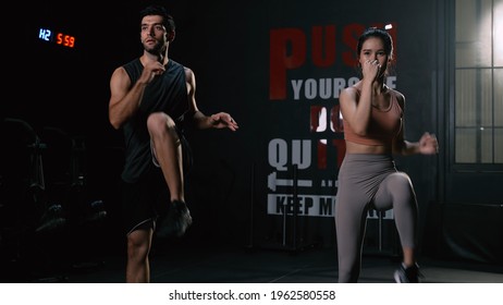 Sporty Couple Cardio Exercise Burning Calorie HIIT And Squat In Fitness Gym Fit Body Healthy Lifestyle Athlete Muscle Building Strong Concept.