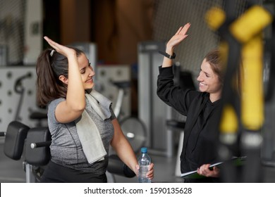 Sporty Couple High Five At Gym