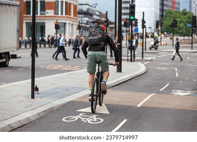 Sporty cyclist on a separate cycle path in London - Powered by Shutterstock