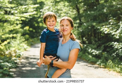 A Sporty Family Mother And Son Outside In Forest