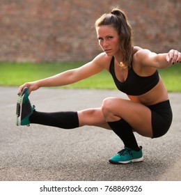 Sporty Female Athlete Doing Pistol Squats