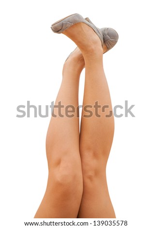 sporty female legs in denim shoes
