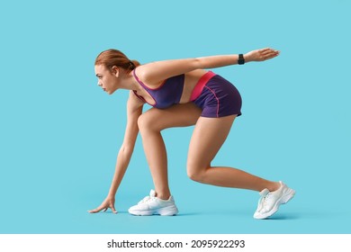 Sporty female runner on color background