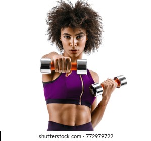 Sporty girl doing boxing exercises, making direct hit with dumbbells. Photo of african girl on white background. Strength and motivation - Powered by Shutterstock