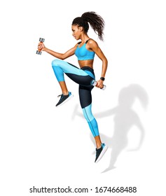 Sporty Girl Jumping With Dumbbells. Photo Of African American Girl In Fashionable Sportswear On White Background. Dynamic Movement. Side View. Full Length. Sports And Healthy Lifestyle