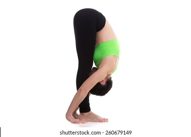 Sporty Girl On White Background In Uttanasana (intense Stretch Pose, Forward Bend, Forward Fold Pose, Head To Knees Pose), Asana From Surya Namaskar Sequence, Sun Salutation Complex