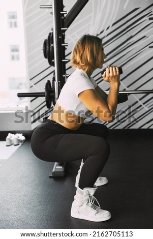 Similar – Image, Stock Photo young woman foam rolling after exercise in gym