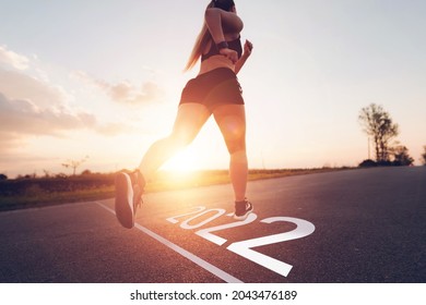 Sporty Girl Running To 2022 Year. Goals, Plans And Visions For Next Year 2022.