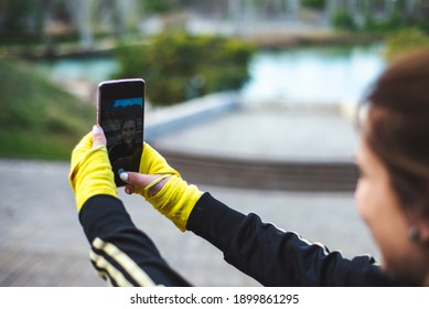 Sporty Girl Taking A Self Portrait Photography At Park.