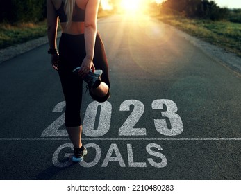 Sporty girl waiting for the new year 2023 to begin. New  goals in new year 2023. - Shutterstock ID 2210480283