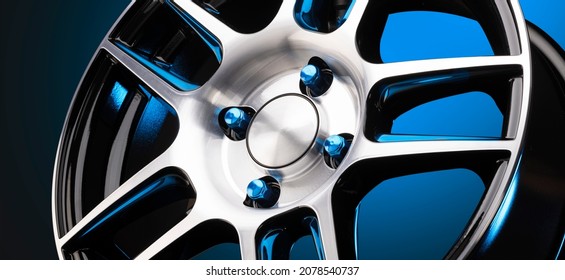 Sporty Lightweight New Alloy Wheel With Blue Steel Nuts On A Gradient Blue Background, A Beautiful Auto Concept For A Tire Or Disc Store , Panoramic Photo Black Background