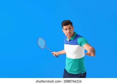 Sporty Male Badminton Player On Color Background