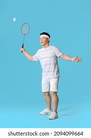 Sporty Male Badminton Player On Color Background