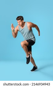 Sporty Male Runner On Color Background