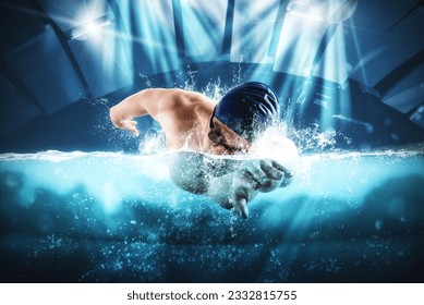 Sporty man athlete swims with energy during a competition in the pool - Powered by Shutterstock