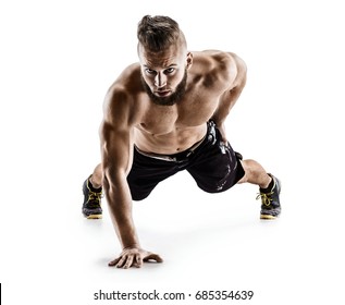 Sporty Man Does Push Ups Exercise On The Floor On His Right Hand. Photo Muscular Man Isolated On White Background. The Strength And Motivation