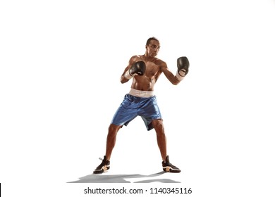 Sporty man during boxing exercises. Photo of boxer on isolated on white background. Strength, attack and motion concept. Fit african american model in movement. Afro muscular athlete in sport uniform - Powered by Shutterstock