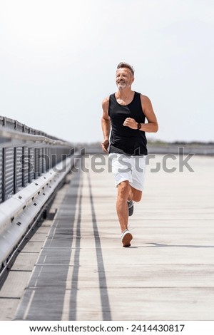 Sporty man jogging stock photo