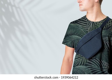 Sporty man with navy belt bag streetwear studio shoot