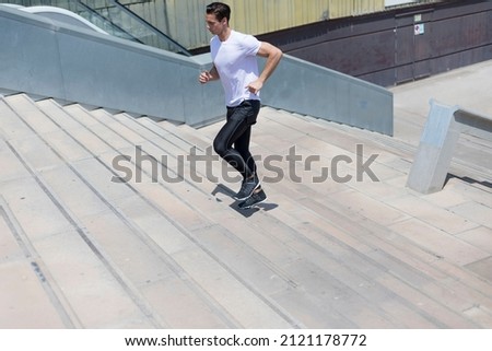 Similar – Happy man and jumping outdoors, warmup before jogging