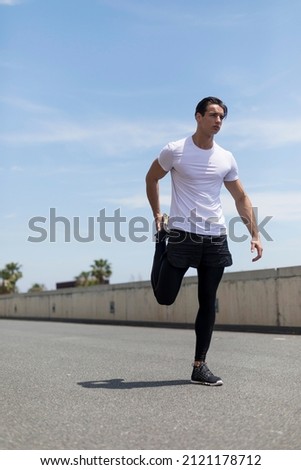 Similar – Image, Stock Photo Young man stretching in the city after jogging