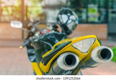 A sporty motorcycle parked in front of a coffee shop - Powered by Shutterstock