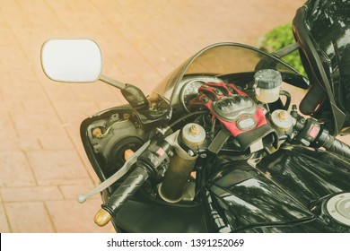 A sporty motorcycle parked in front of a coffee shop - Powered by Shutterstock