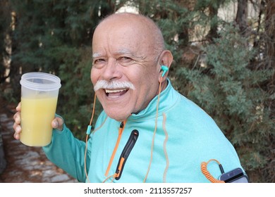 Sporty Senior Bald Man With A Mustache Drinking Protein Shake